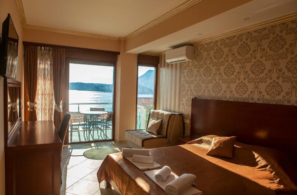 Room with sea view terrace and sofa