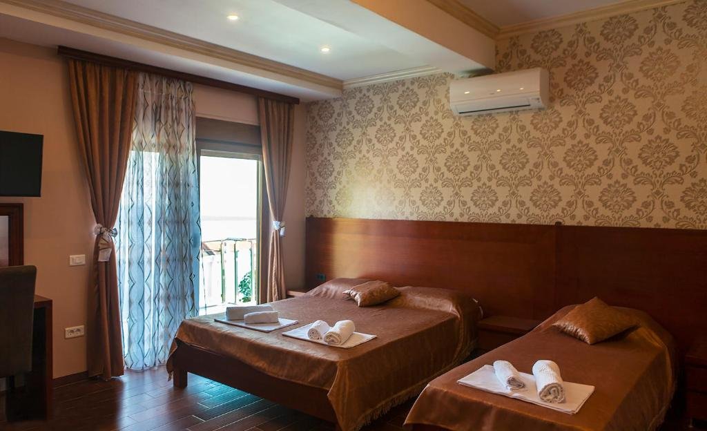 Family room with two beds and a balcony